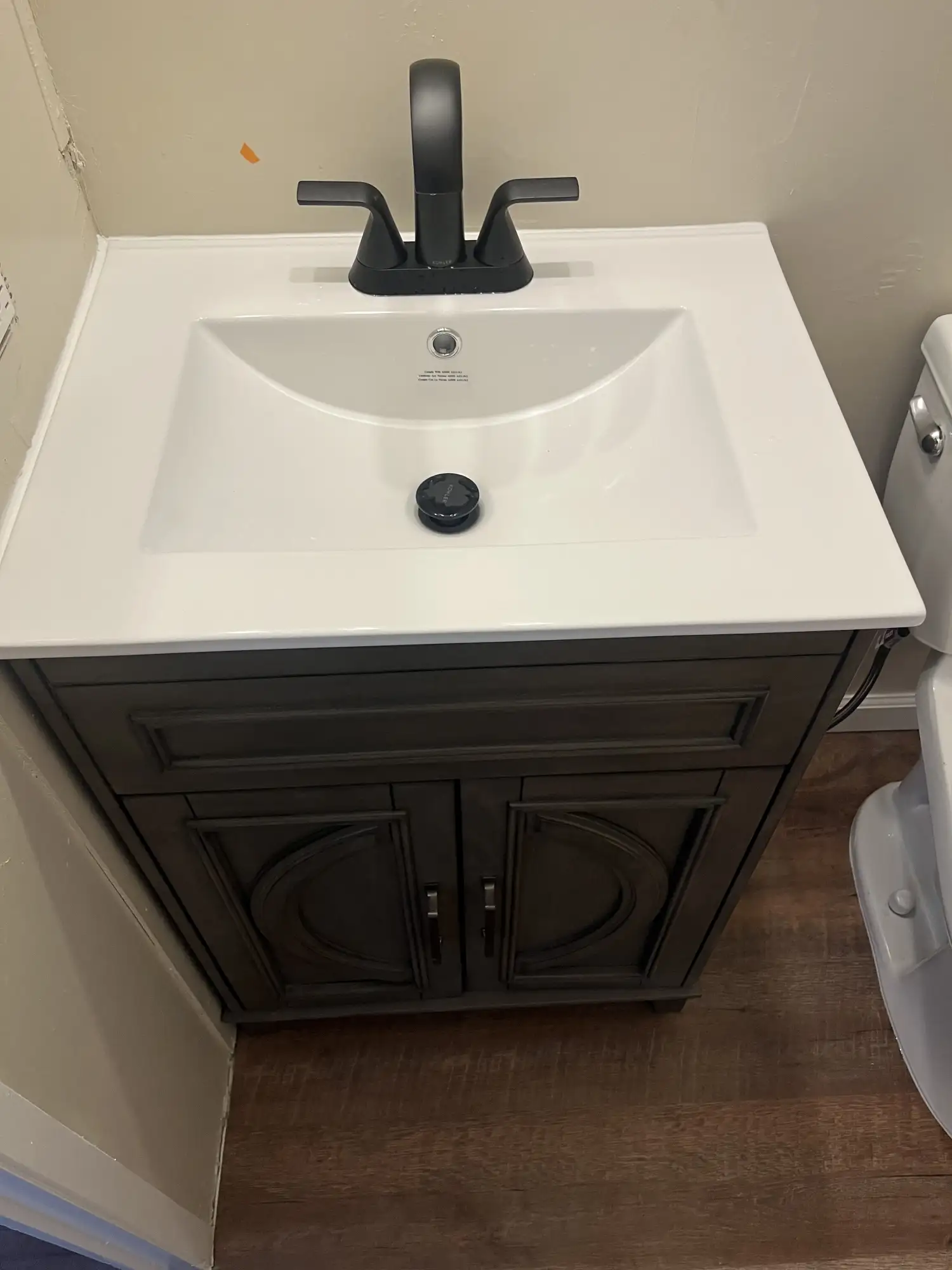 Modern bathroom sink with faucet, installed in a residential bathroom.