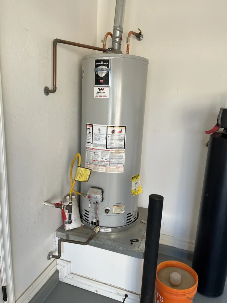 Gas/Electric tank water heater, showing a typical home hot water storage system.